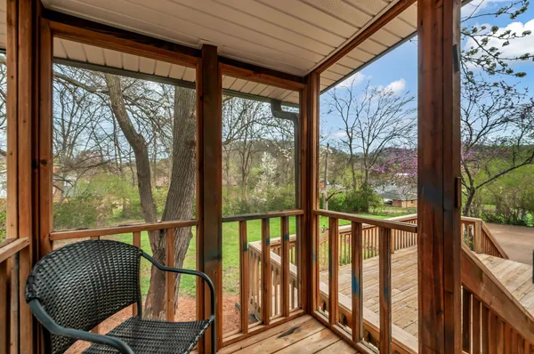 a view of balcony with wooden floor
