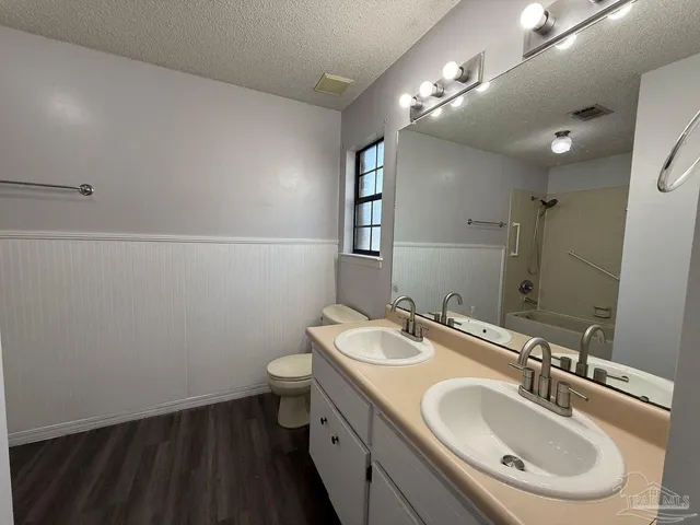 a bathroom with a bathtub a toilet and a sink