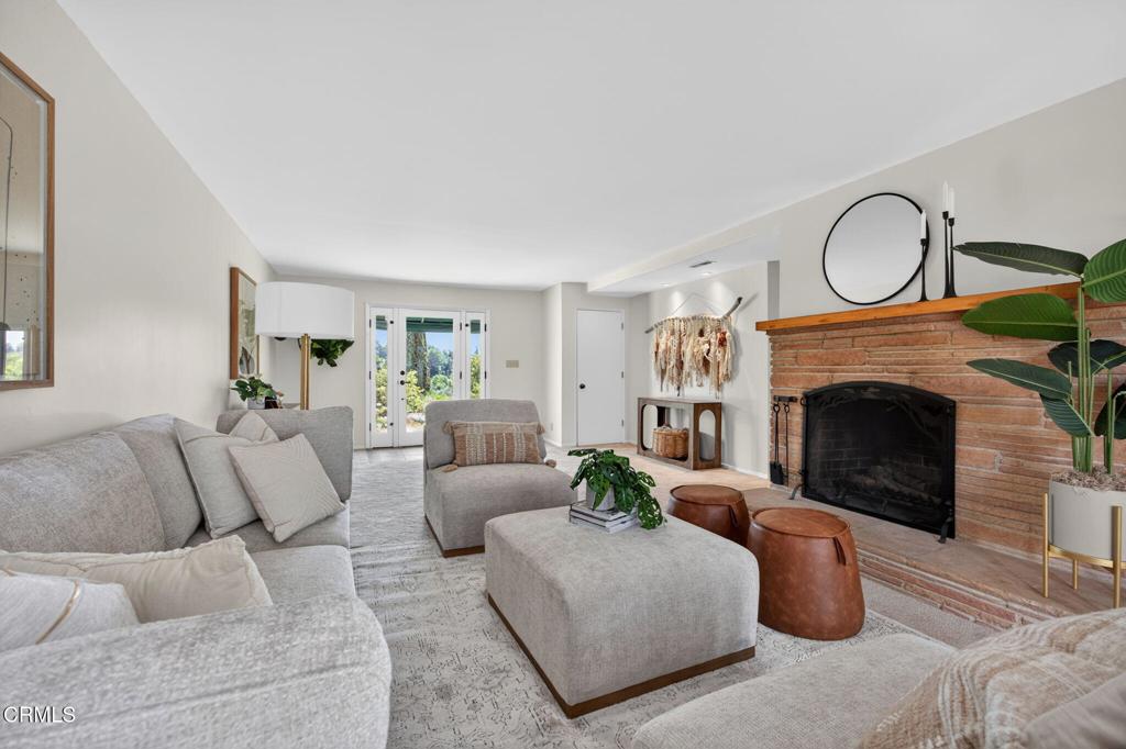 98 Howard Avenue Oak View, CA 93022 - Photo 10 of 72 a living room with furniture a rug and a fireplace