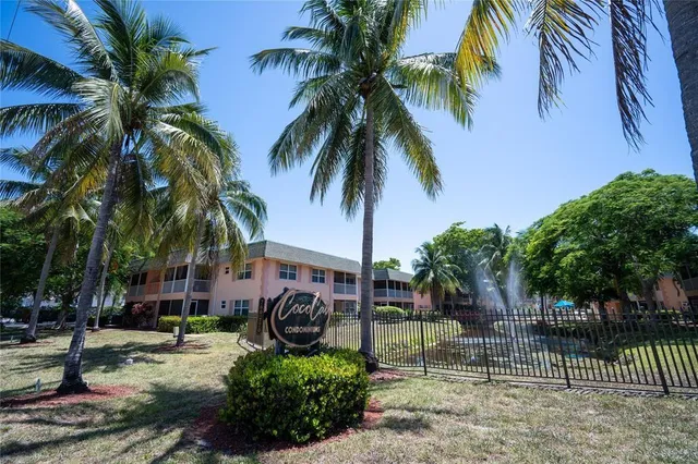 a house with palm tree in front of it