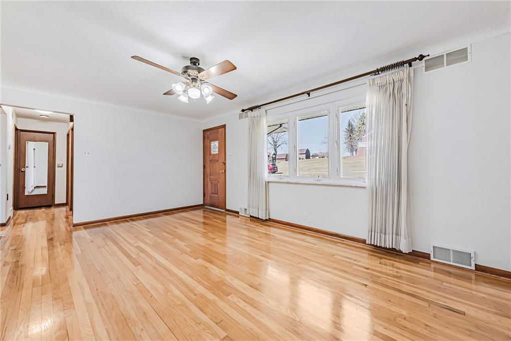 310 Longwood Drive Irwin, PA 15642 - Photo 12 of 25 a view of an empty room with window and a kitchen
