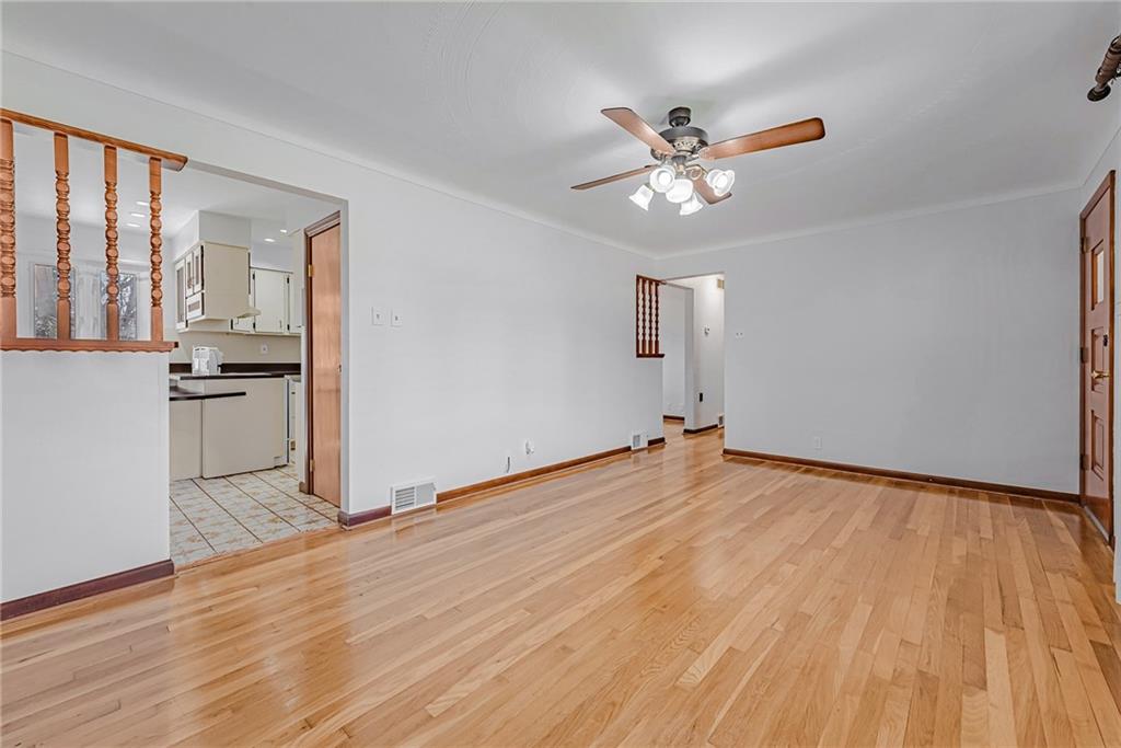 310 Longwood Drive Irwin, PA 15642 - Photo 13 of 25 a view of empty room with wooden floor and fan