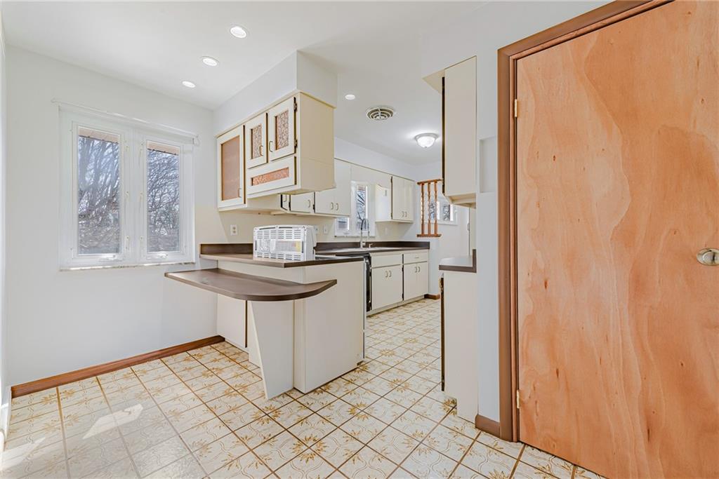 310 Longwood Drive Irwin, PA 15642 - Photo 14 of 25 a kitchen with stainless steel appliances granite countertop a refrigerator and a stove top oven