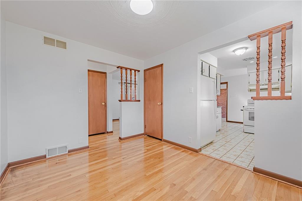 310 Longwood Drive Irwin, PA 15642 - Photo 16 of 25 a view of an empty room with wooden floor and a window
