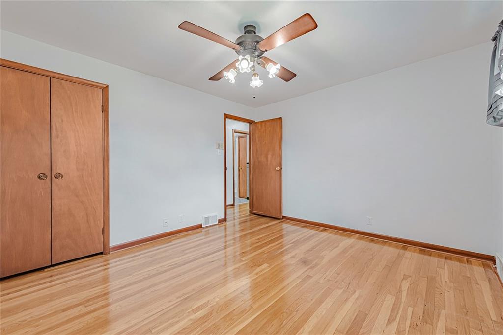 310 Longwood Drive Irwin, PA 15642 - Photo 18 of 25 wooden floor in an empty room with a window