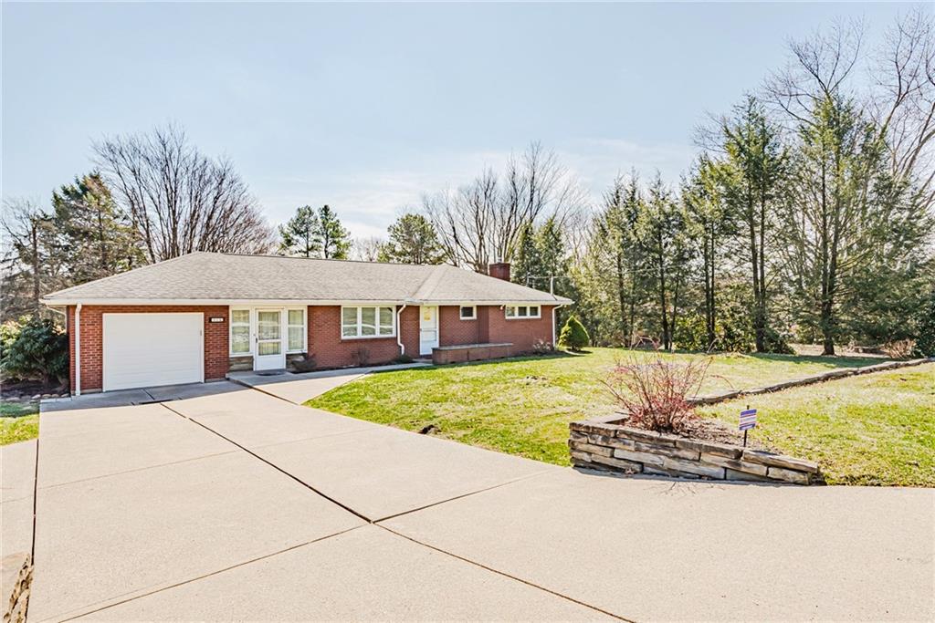 310 Longwood Drive Irwin, PA 15642 - Photo 2 of 25 a view of a house with basketball court