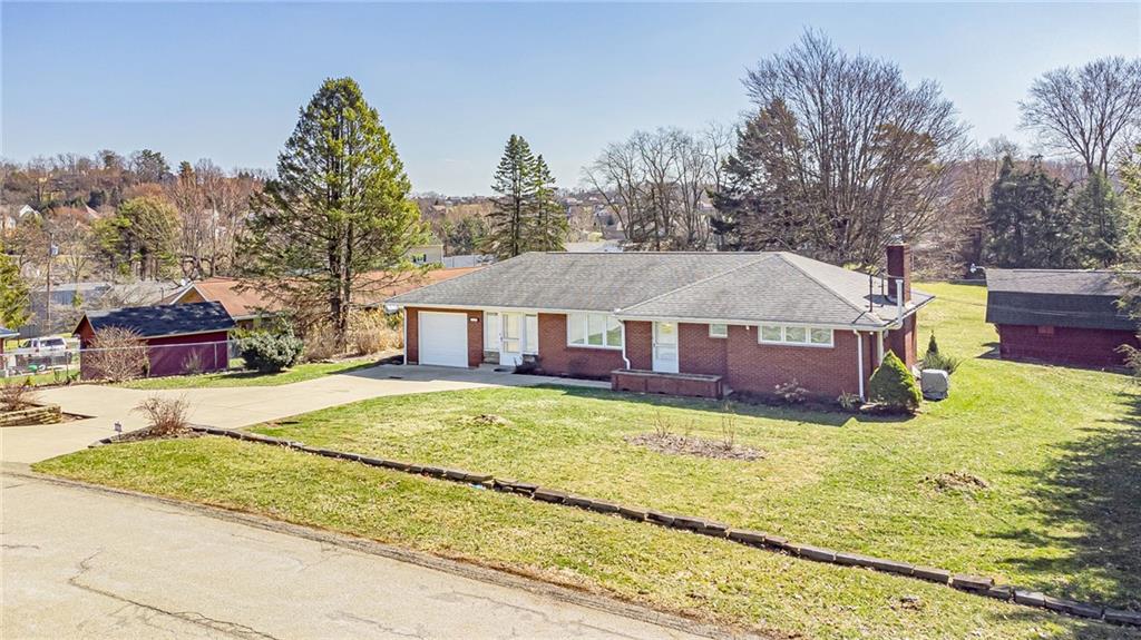 310 Longwood Drive Irwin, PA 15642 - Photo 3 of 25 a view of a house with a yard
