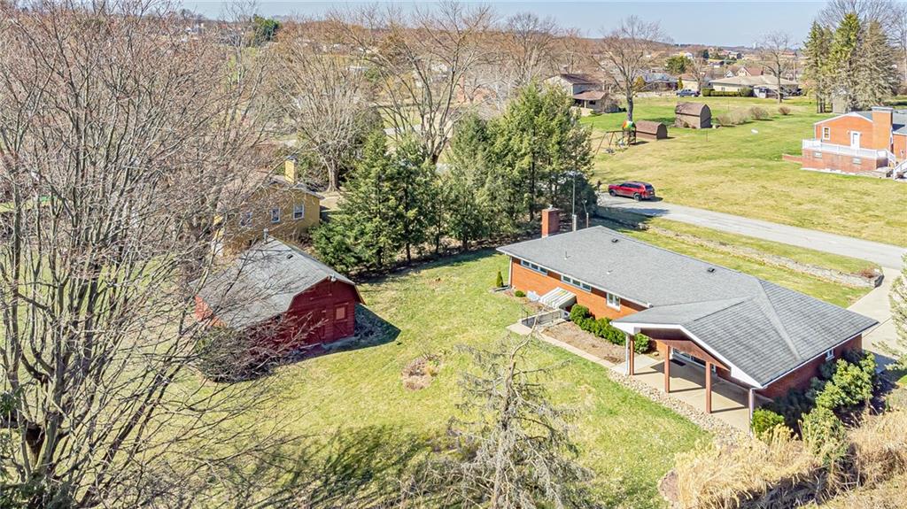 310 Longwood Drive Irwin, PA 15642 - Photo 6 of 25 an aerial view of a house with yard swimming pool and lake view