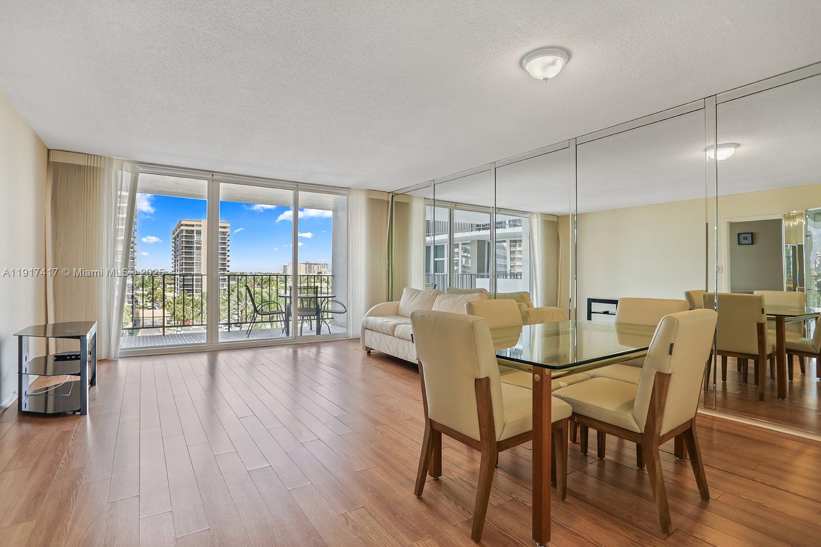 2030 South Ocean Drive, Unit 503 Hallandale Beach, FL 33009 - Photo 12 of 41 a view of a dining room with furniture and wooden floor