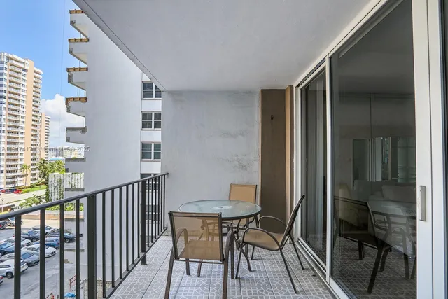 a view of a balcony with chairs