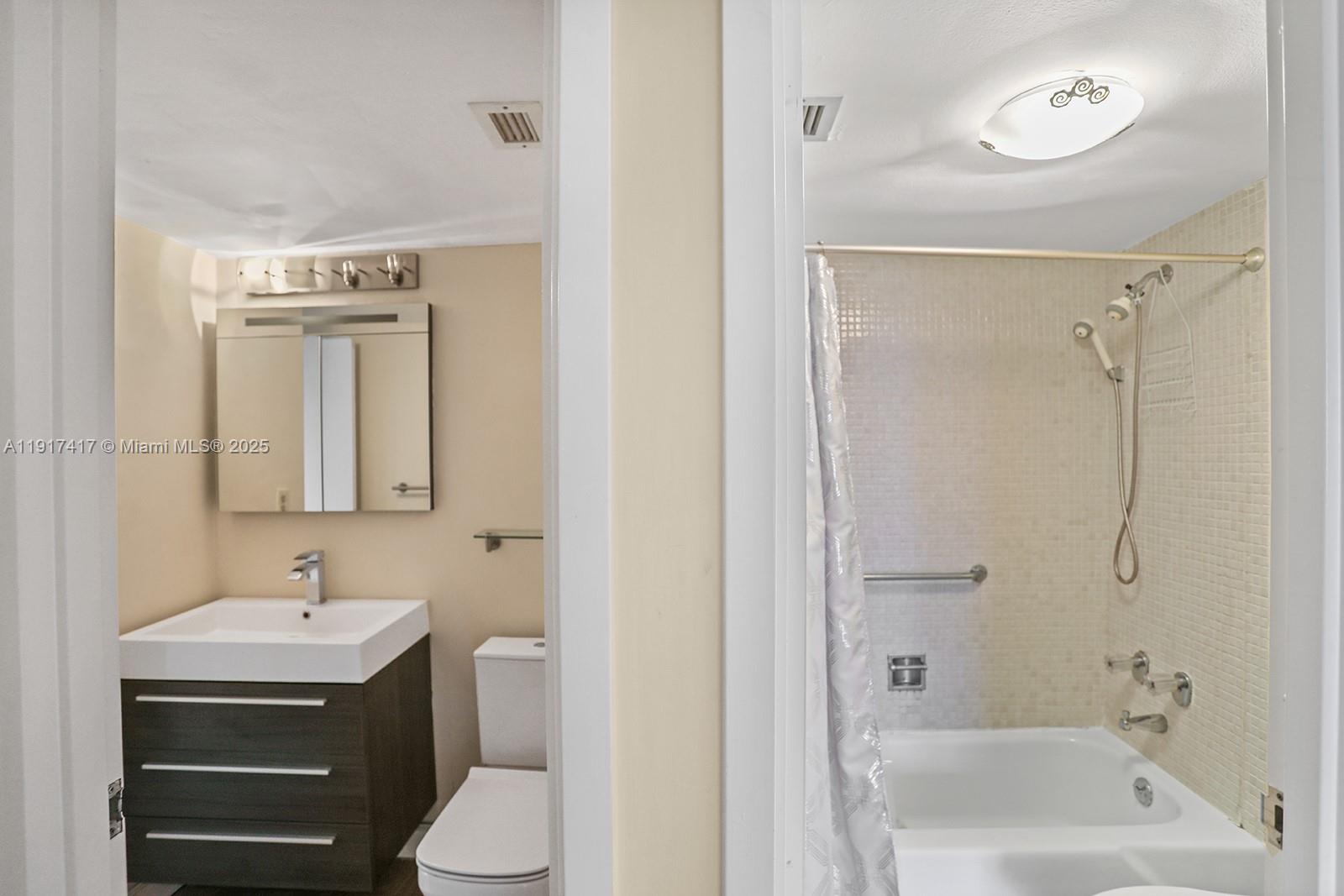 2030 South Ocean Drive, Unit 503 Hallandale Beach, FL 33009 - Photo 29 of 41 a bathroom with a sink a toilet and shower