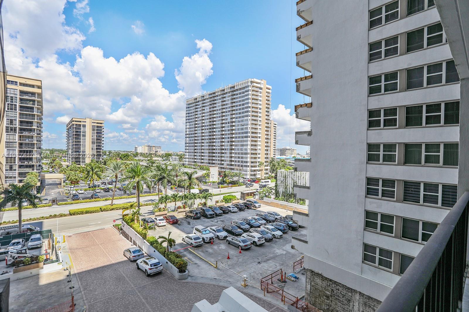 2030 South Ocean Drive, Unit 503 Hallandale Beach, FL 33009 - Photo 3 of 41 a front view of a building with outdoor seating