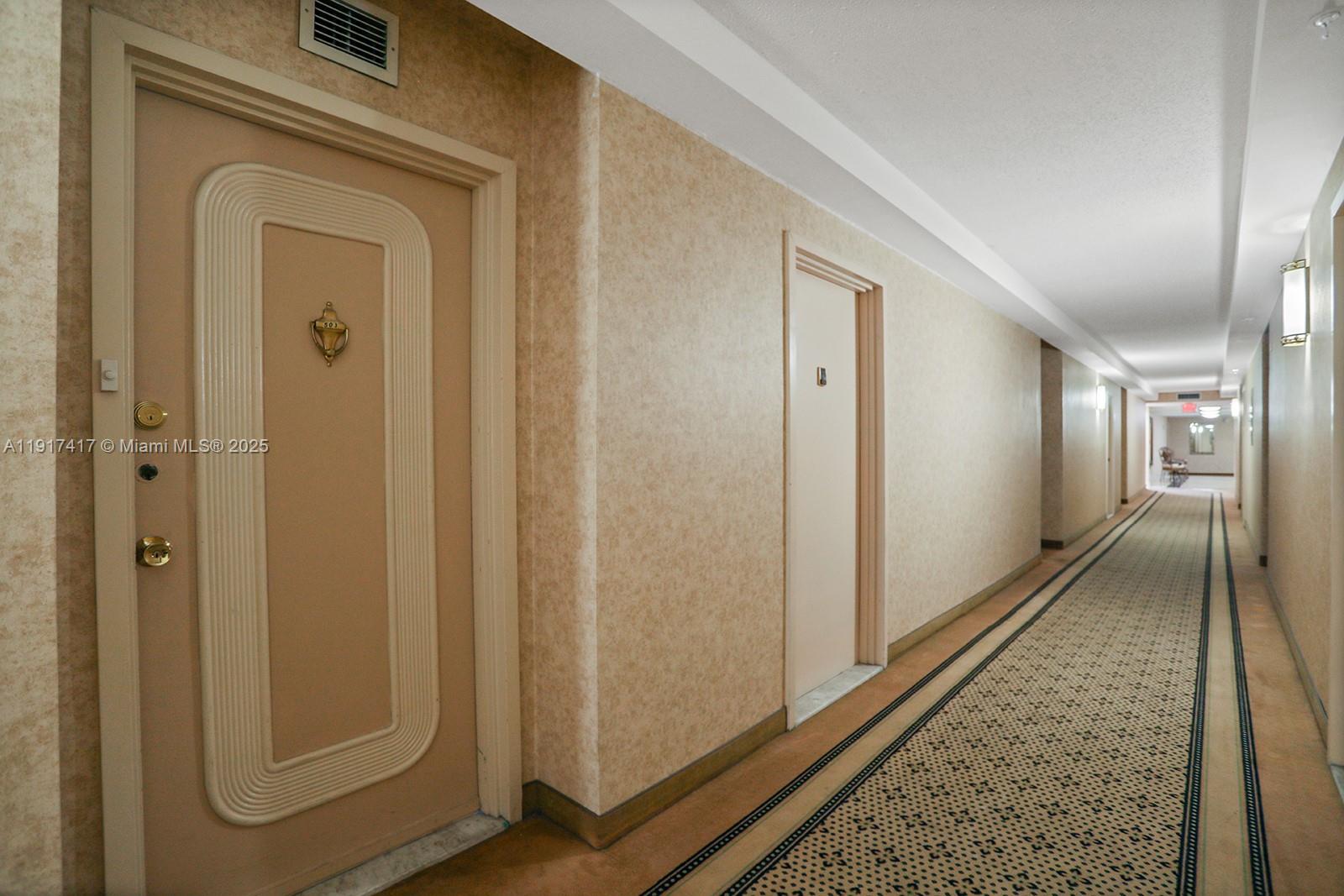 2030 South Ocean Drive, Unit 503 Hallandale Beach, FL 33009 - Photo 5 of 41 a view of a hallway with wooden floor