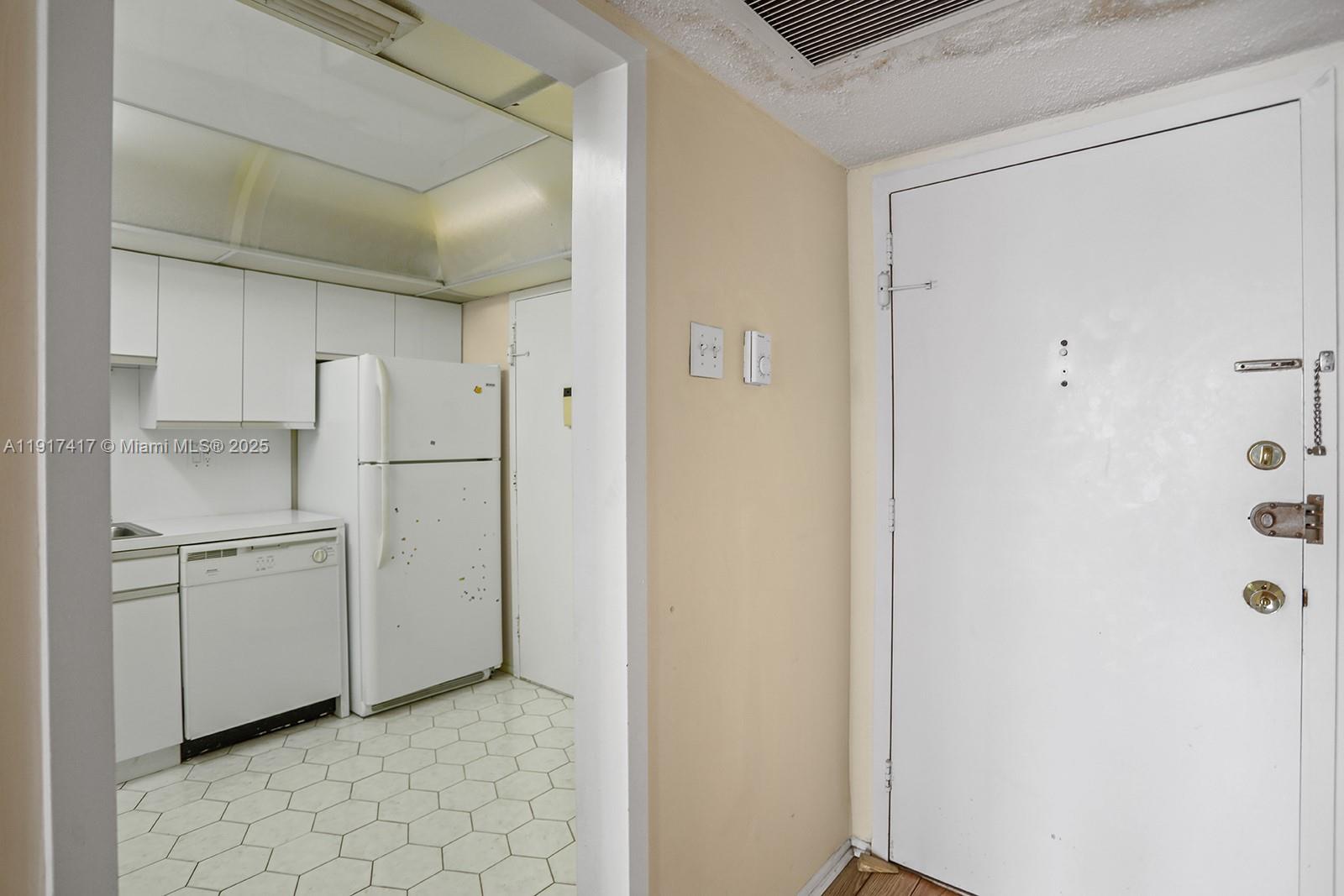 2030 South Ocean Drive, Unit 503 Hallandale Beach, FL 33009 - Photo 10 of 41 a view of cabinets and refrigerator