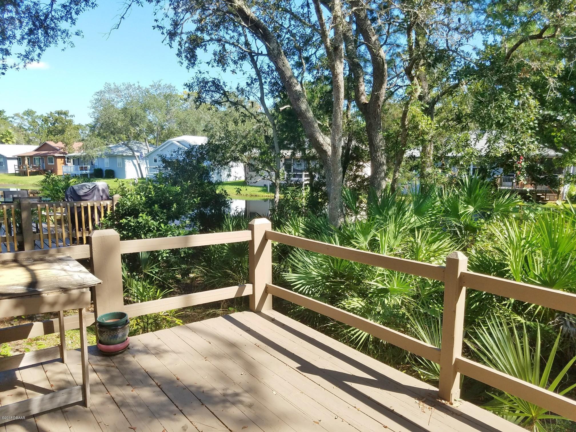 86 Crooked Pine Road Port Orange, FL 32128 - Photo 6 of 13 deck with pond view