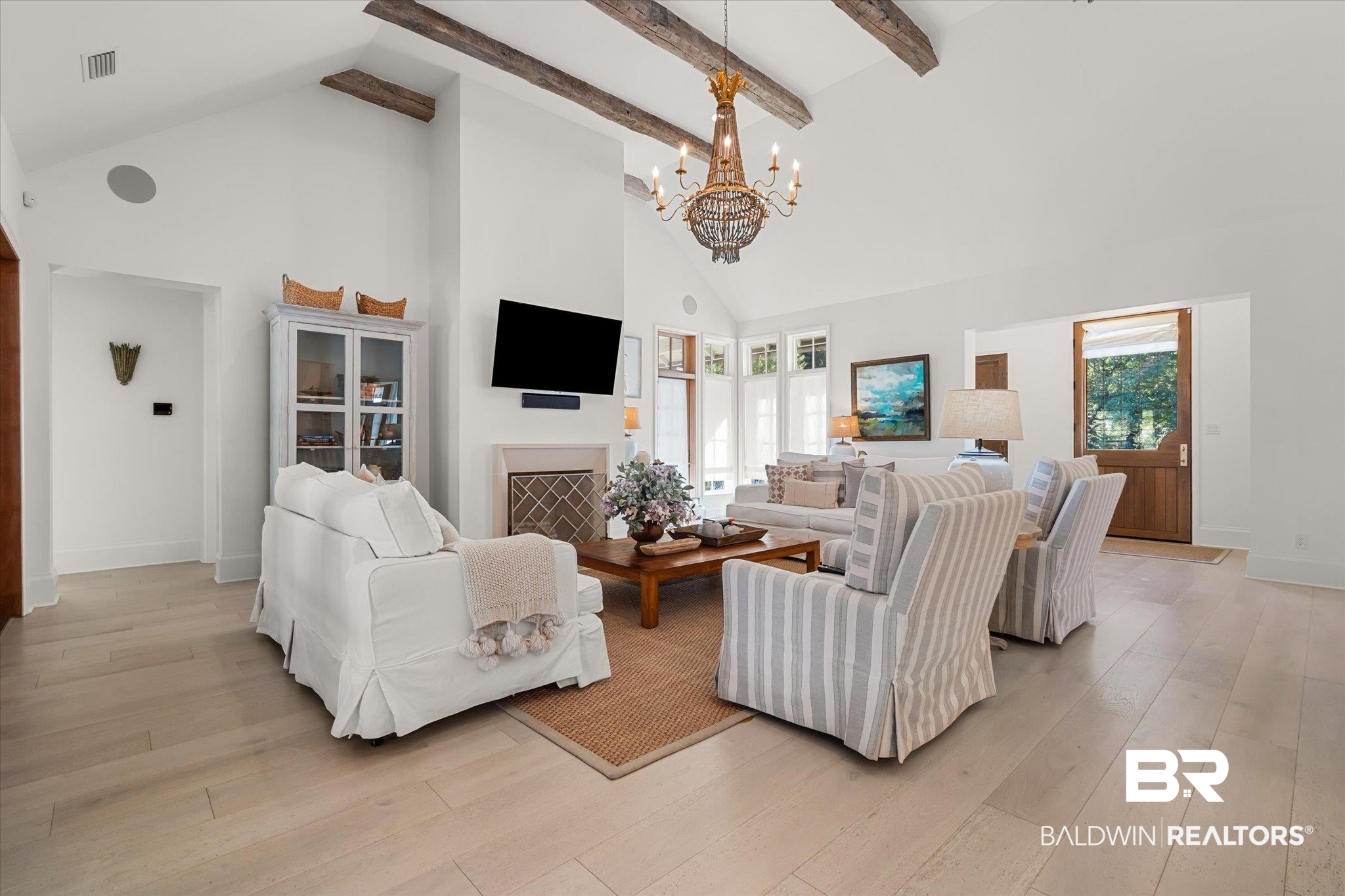 2 Garden Trace Mobile, AL 36608 - Photo 3 of 55 Living room featuring beam ceiling, high vaulted ceiling, a chandelier, and light hardwood / wood-style floors