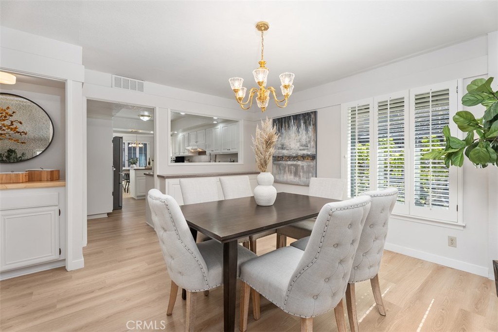 165 Old Ranch Road, Unit 3 Seal Beach, CA 90740 - Photo 10 of 31 Bar area and formal dining space with a pass through to the kitchen