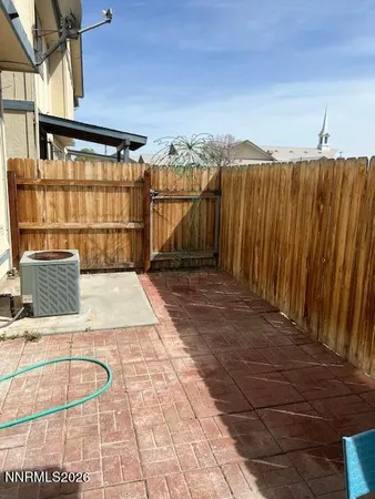 a view of a balcony with wooden floor