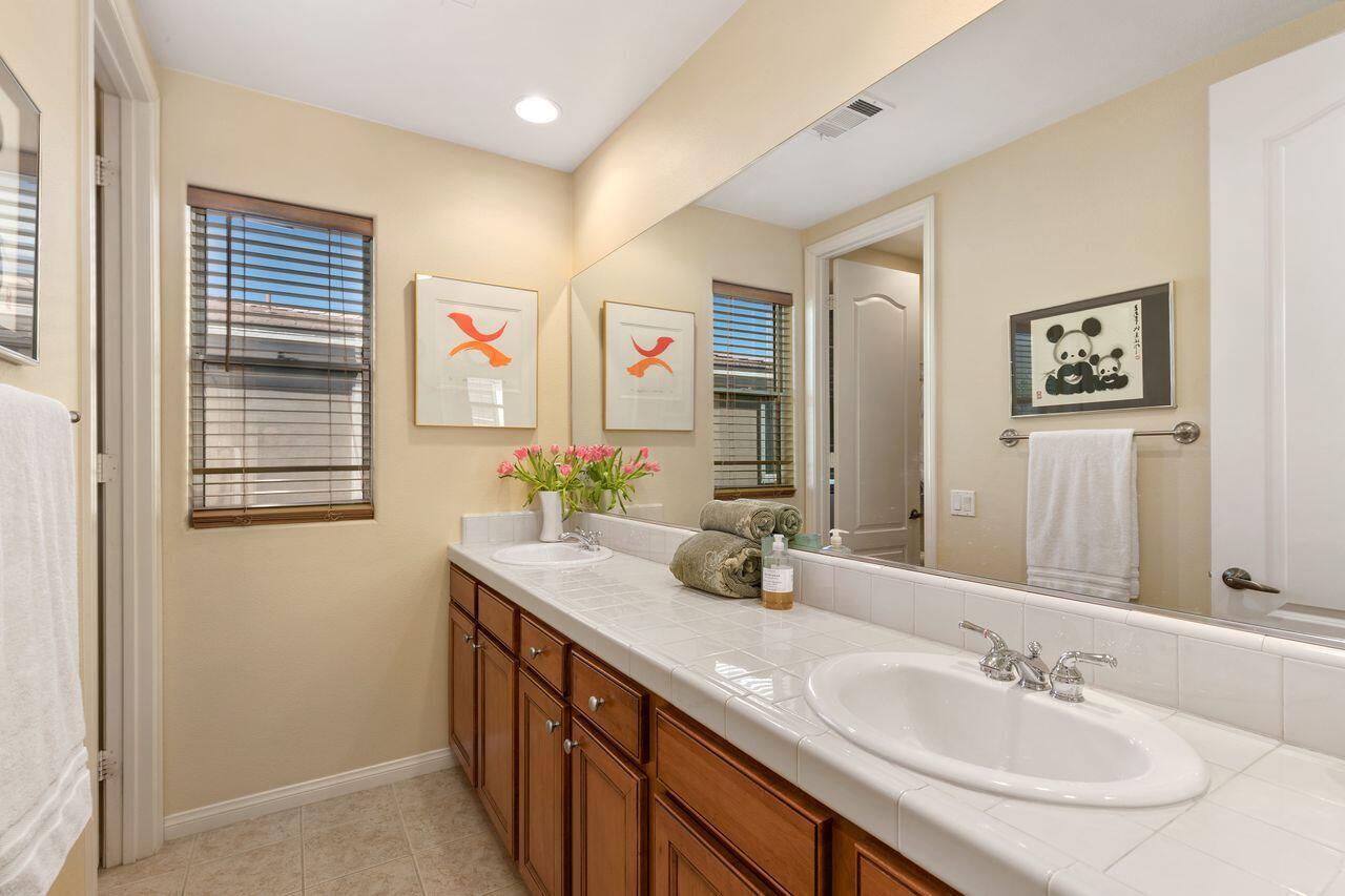 80591 Tangelo Court Indio, CA 92201 - Photo 25 of 30 a bathroom with a sink double vanity and a granite