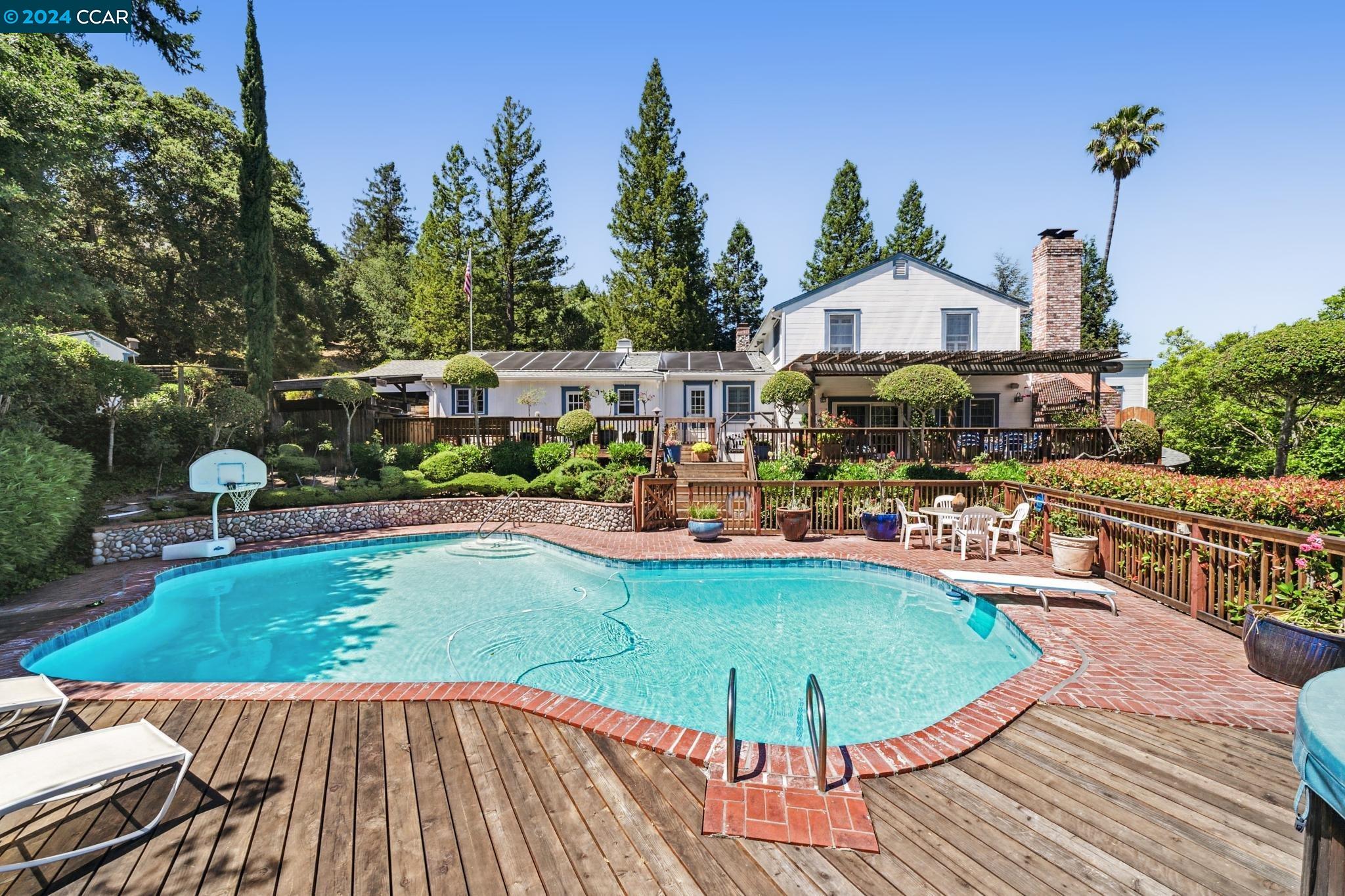 a view of a swimming pool with a patio