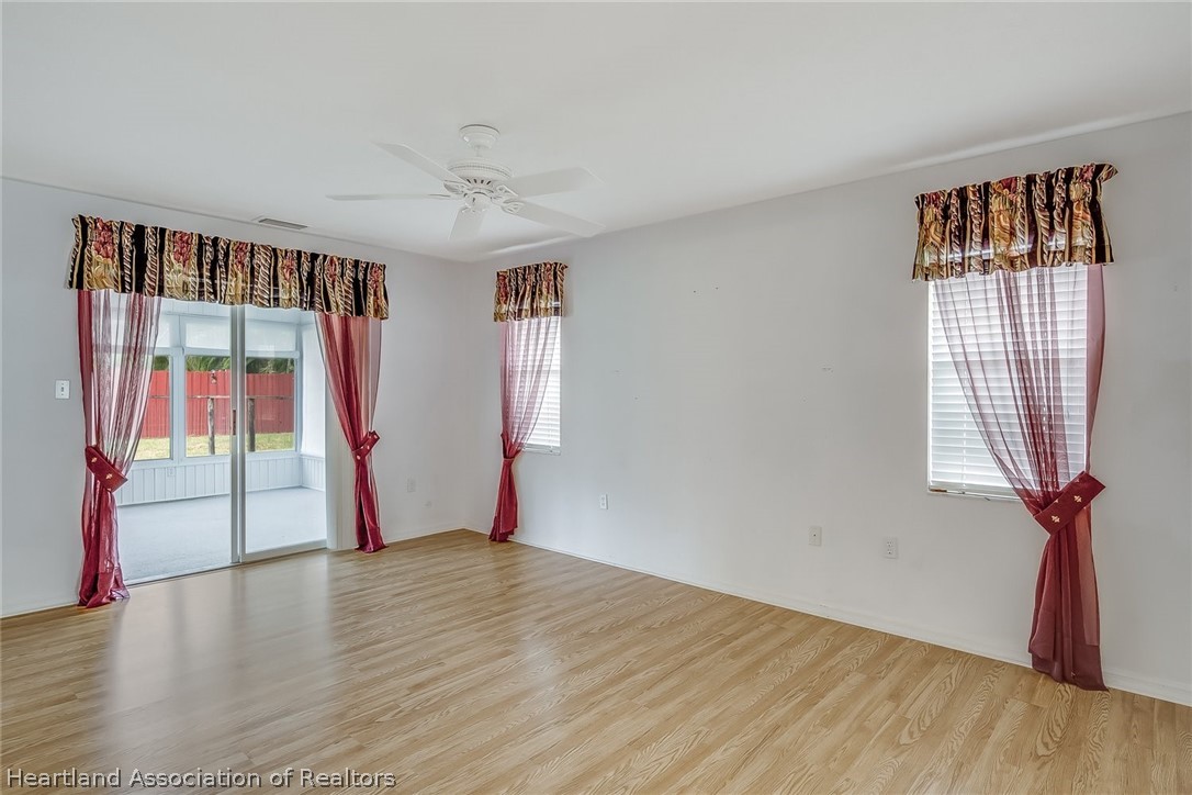 246 Tangerine Road Lake Placid, FL 33852 - Photo 20 of 36 a view of an empty room with glass door