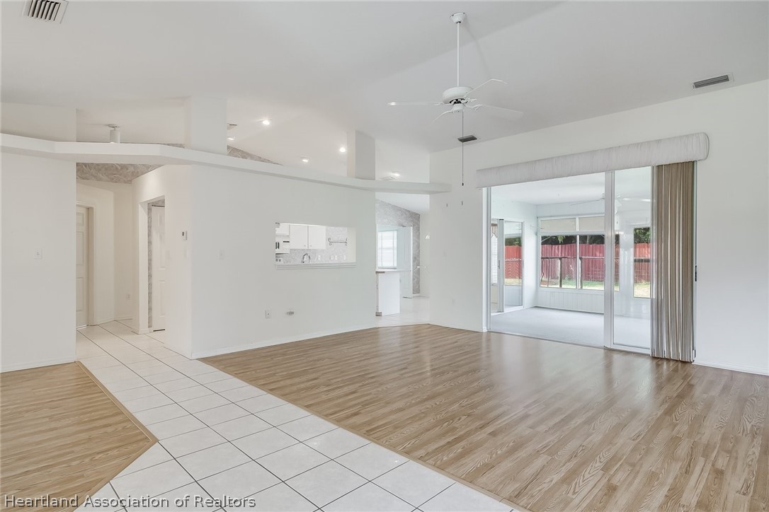 246 Tangerine Road Lake Placid, FL 33852 - Photo 2 of 36 wooden floor in an empty room with a window