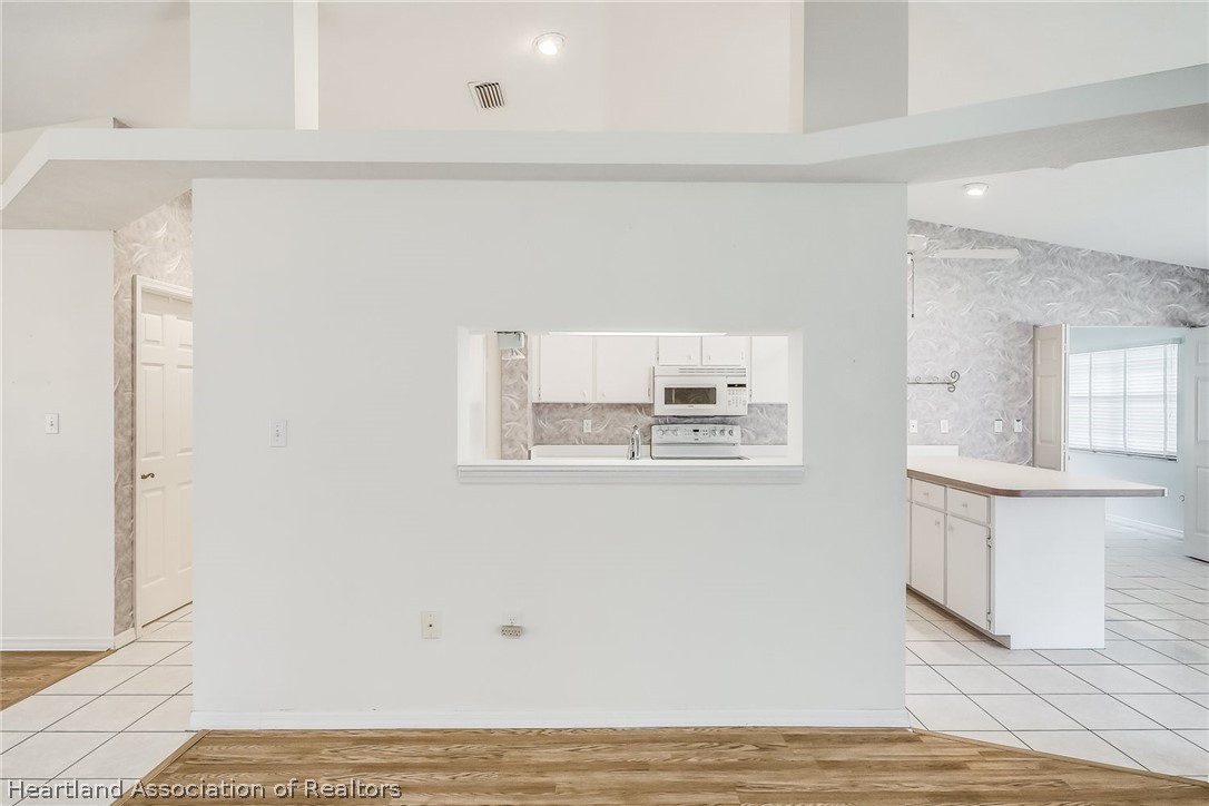 246 Tangerine Road Lake Placid, FL 33852 - Photo 5 of 36 a view of kitchen with wooden floor