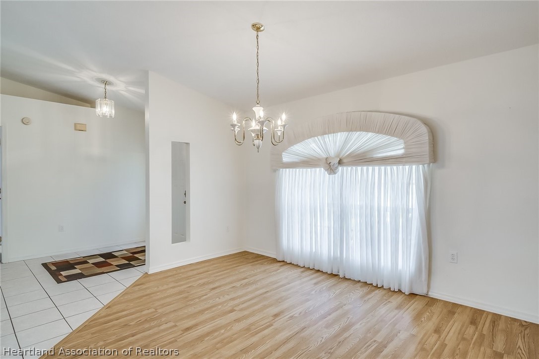 246 Tangerine Road Lake Placid, FL 33852 - Photo 7 of 36 a view of a room with wooden floor