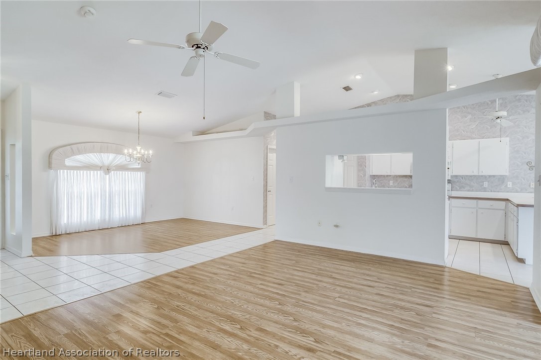 246 Tangerine Road Lake Placid, FL 33852 - Photo 9 of 36 a view of empty room with wooden floor and fan