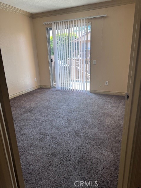 995 Margarita Drive, Unit F203 Corona, CA 92879 - Photo 6 of 12 a view of an empty room with a window