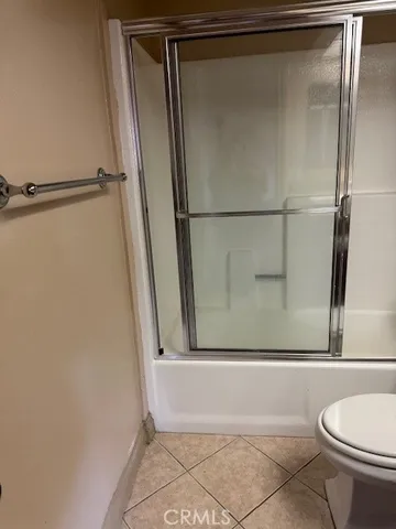 a bathroom with a shower and a toilet