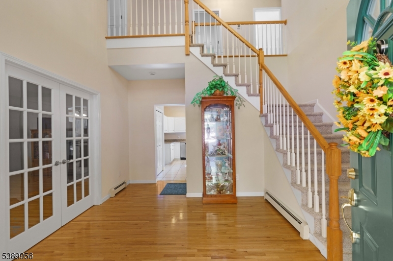 3 Hidden Hills Road Oak Ridge, NJ 07438 - Photo 2 of 32 a view of entryway with wooden floor and stairs