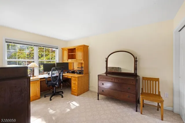 a work room with furniture and a window