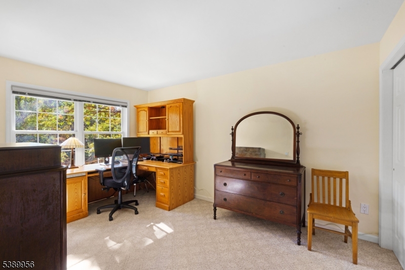 3 Hidden Hills Road Oak Ridge, NJ 07438 - Photo 22 of 32 a work room with furniture and a window