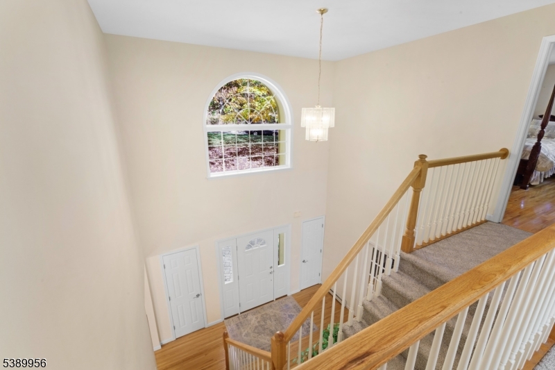 3 Hidden Hills Road Oak Ridge, NJ 07438 - Photo 25 of 32 a view of an entryway with wooden floor