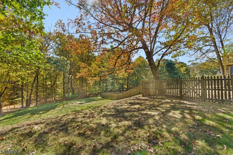 3 Hidden Hills Road Oak Ridge, NJ 07438 - Photo 30 of 32 a view of a yard with trees