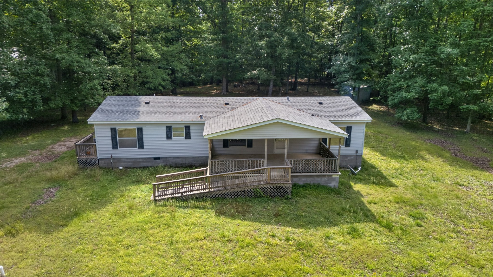 228 Shasteen Ridge Road Lynchburg, TN 37352 - Photo 47 of 53 an aerial view of a house with swimming pool next to a yard