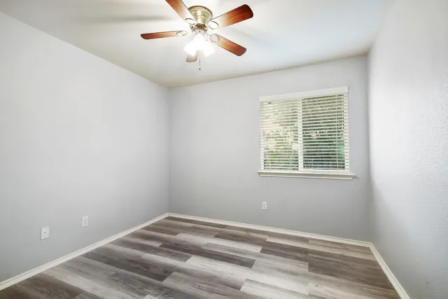 a bathroom with a sink toilet vanity and shower