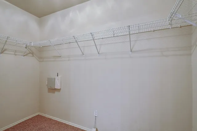 a view of a backyard with a garden and wooden fence