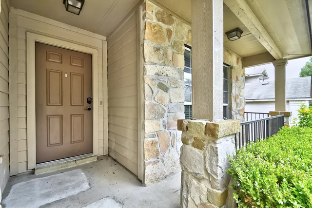 a kitchen with stainless steel appliances granite countertop wooden cabinets a stove top oven a sink and dishwasher