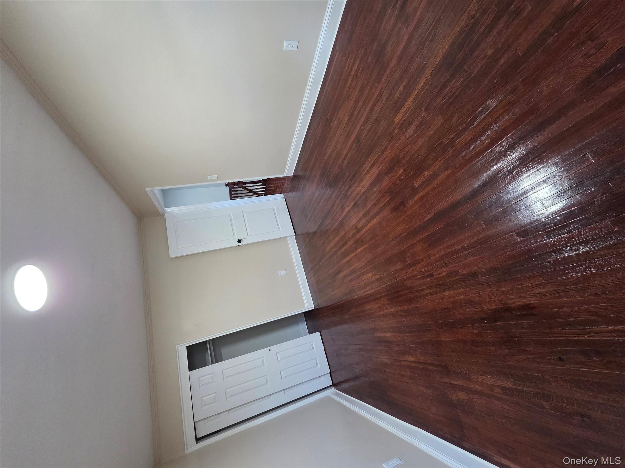 4160 Baychester Avenue Bronx, NY 10466 - Photo 11 of 24 wooden floor in an empty room with a window