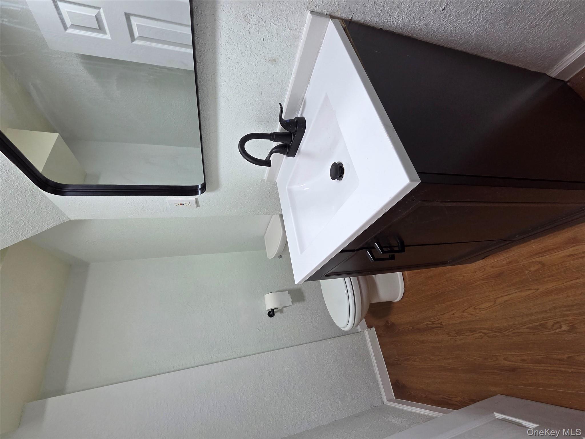 4160 Baychester Avenue Bronx, NY 10466 - Photo 20 of 24 a bathroom with a sink and a toilet