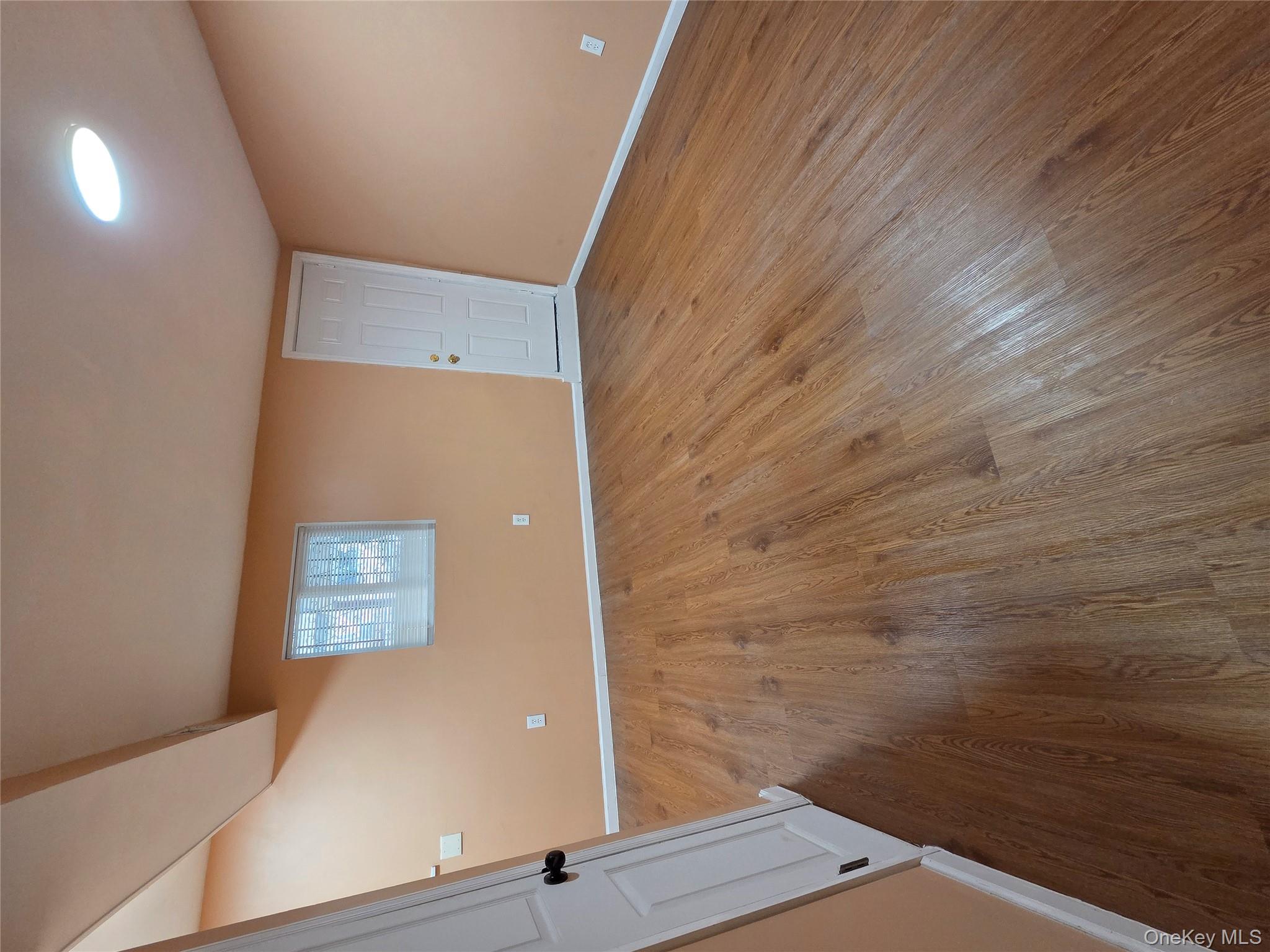 4160 Baychester Avenue Bronx, NY 10466 - Photo 21 of 24 wooden floor in an empty room with a window