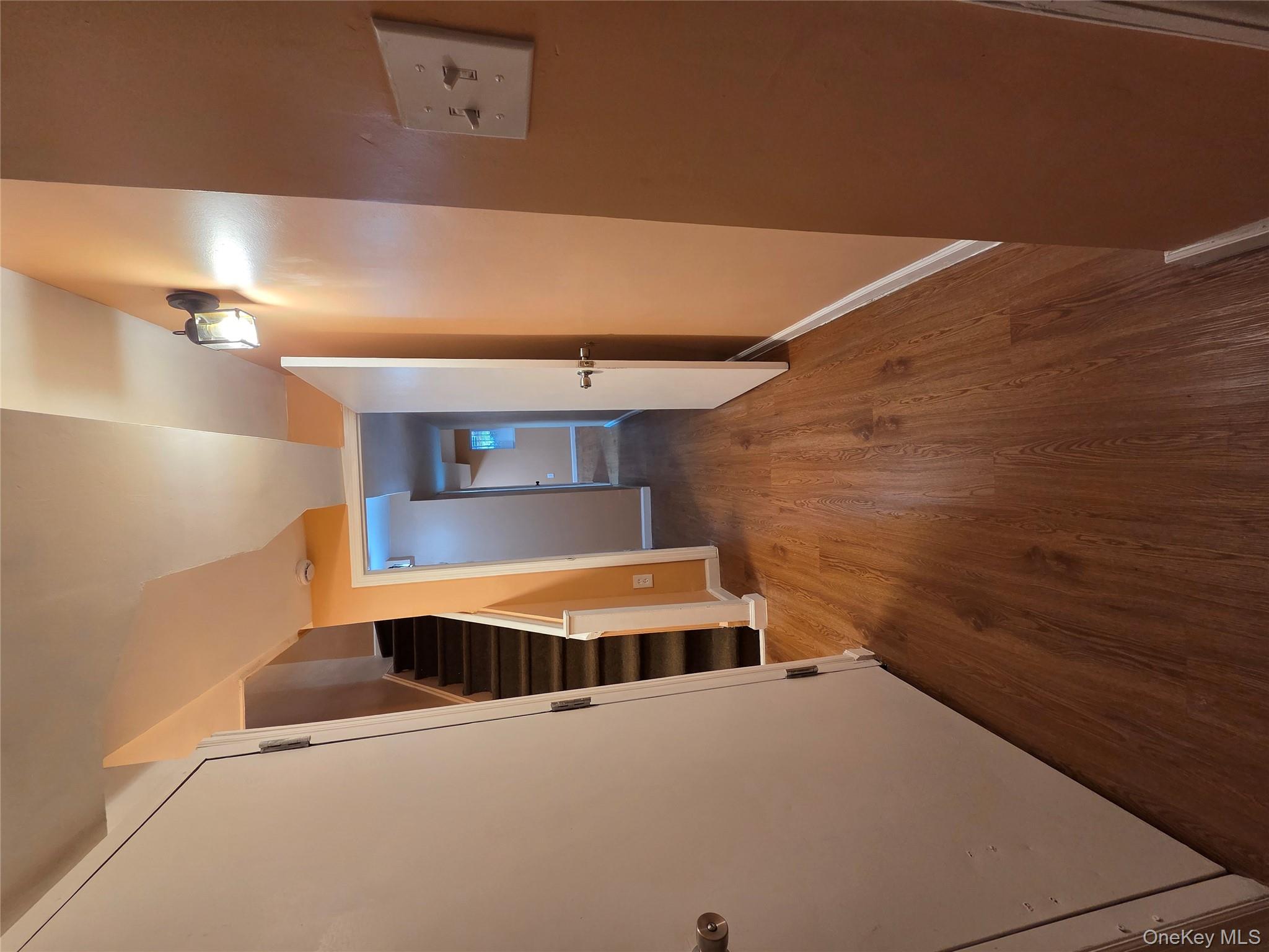 4160 Baychester Avenue Bronx, NY 10466 - Photo 23 of 24 a view of a hallway with wooden floor and staircase