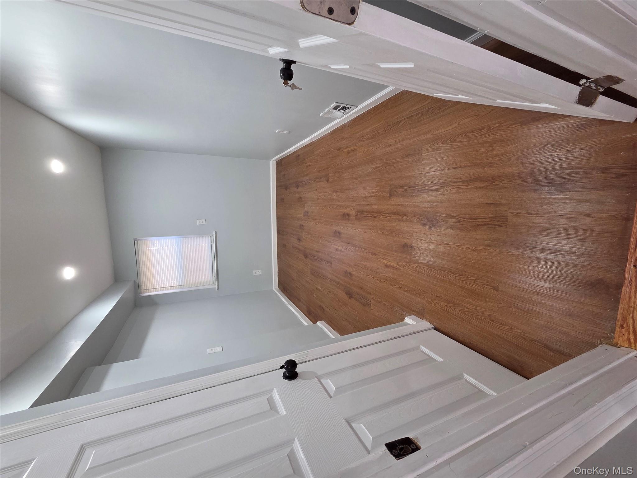 4160 Baychester Avenue Bronx, NY 10466 - Photo 3 of 24 wooden floor in an empty room with a window