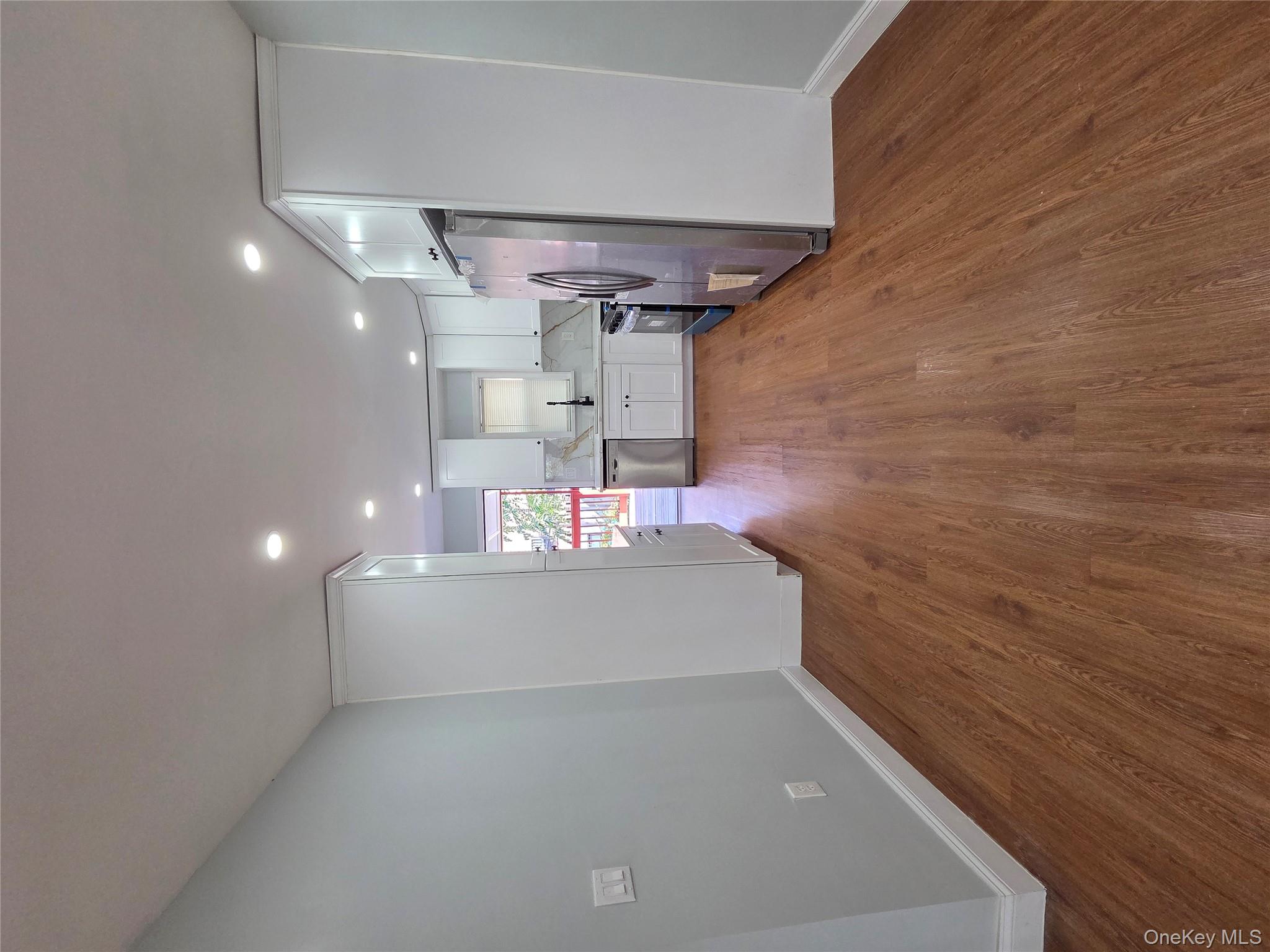 4160 Baychester Avenue Bronx, NY 10466 - Photo 8 of 24 a view of kitchen with wooden floor