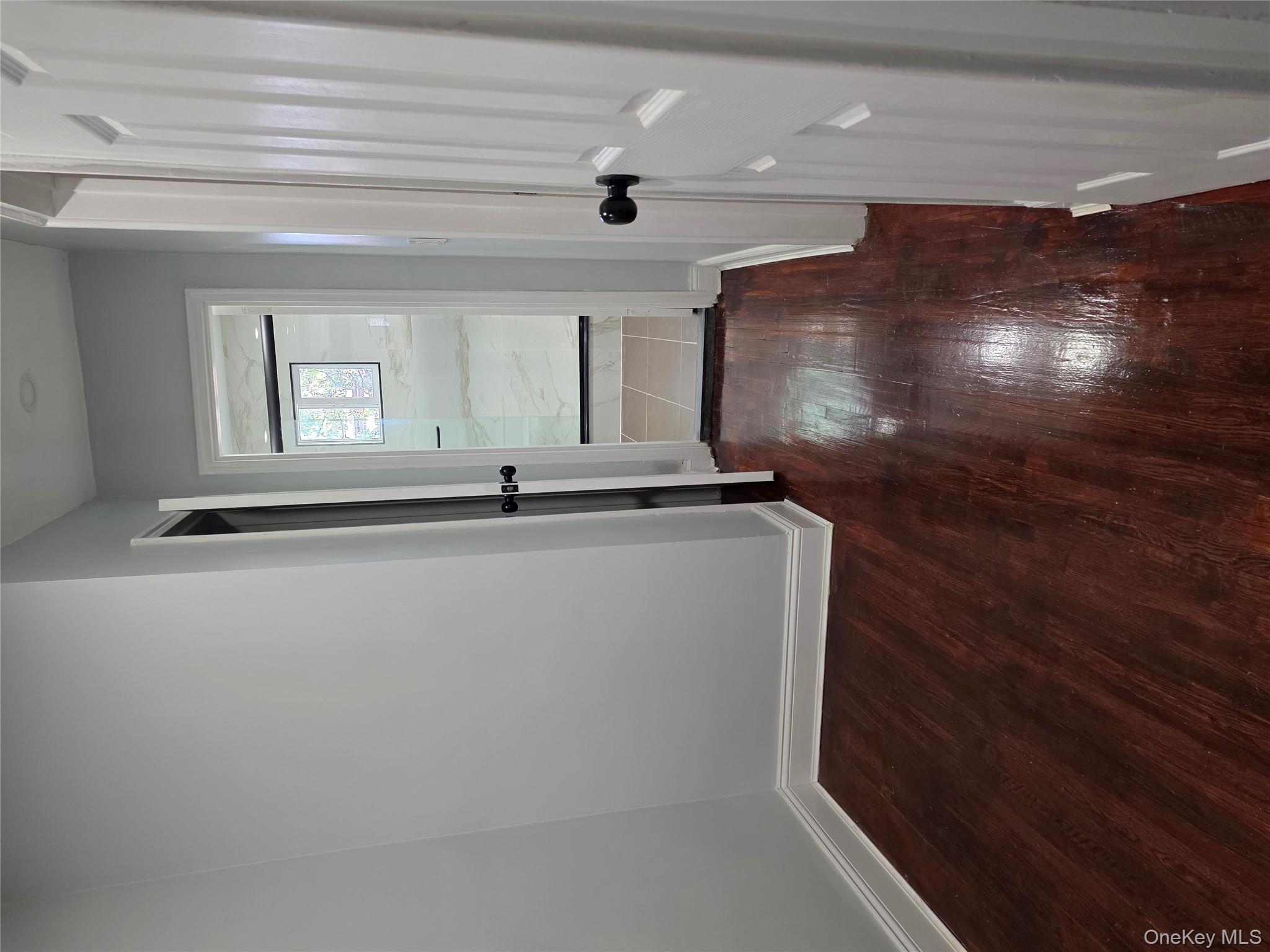 4160 Baychester Avenue Bronx, NY 10466 - Photo 10 of 24 wooden floor in a hallway with a window