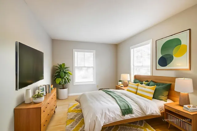 a bedroom with a bed and window