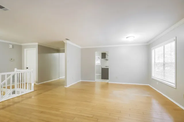 a view of an empty room with a window