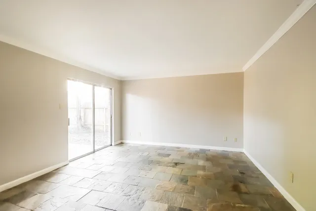 a view of an empty room and window